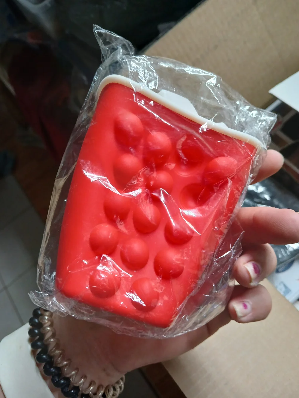 a Soda Clicker fidget toy or a similar 3D-printed accessory.